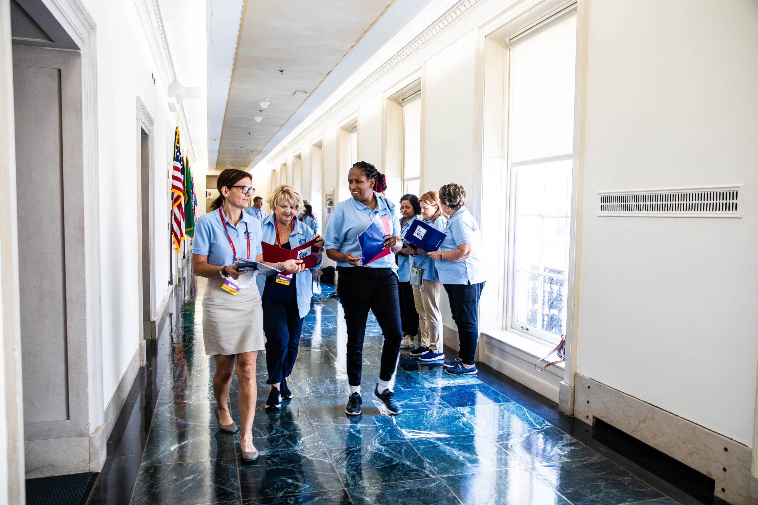 volunteers walking inside the Capitol