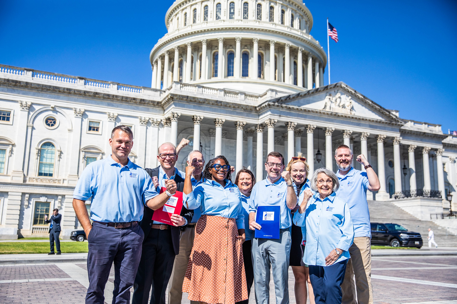 volunteers standing in front of the Capitol