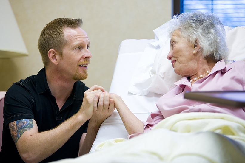 Photo of mother in treatment with caregiver son