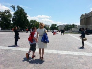 Photo of Seth Wooldridge A.K.A. Rumbleman walking on Capitol Hill with his mother