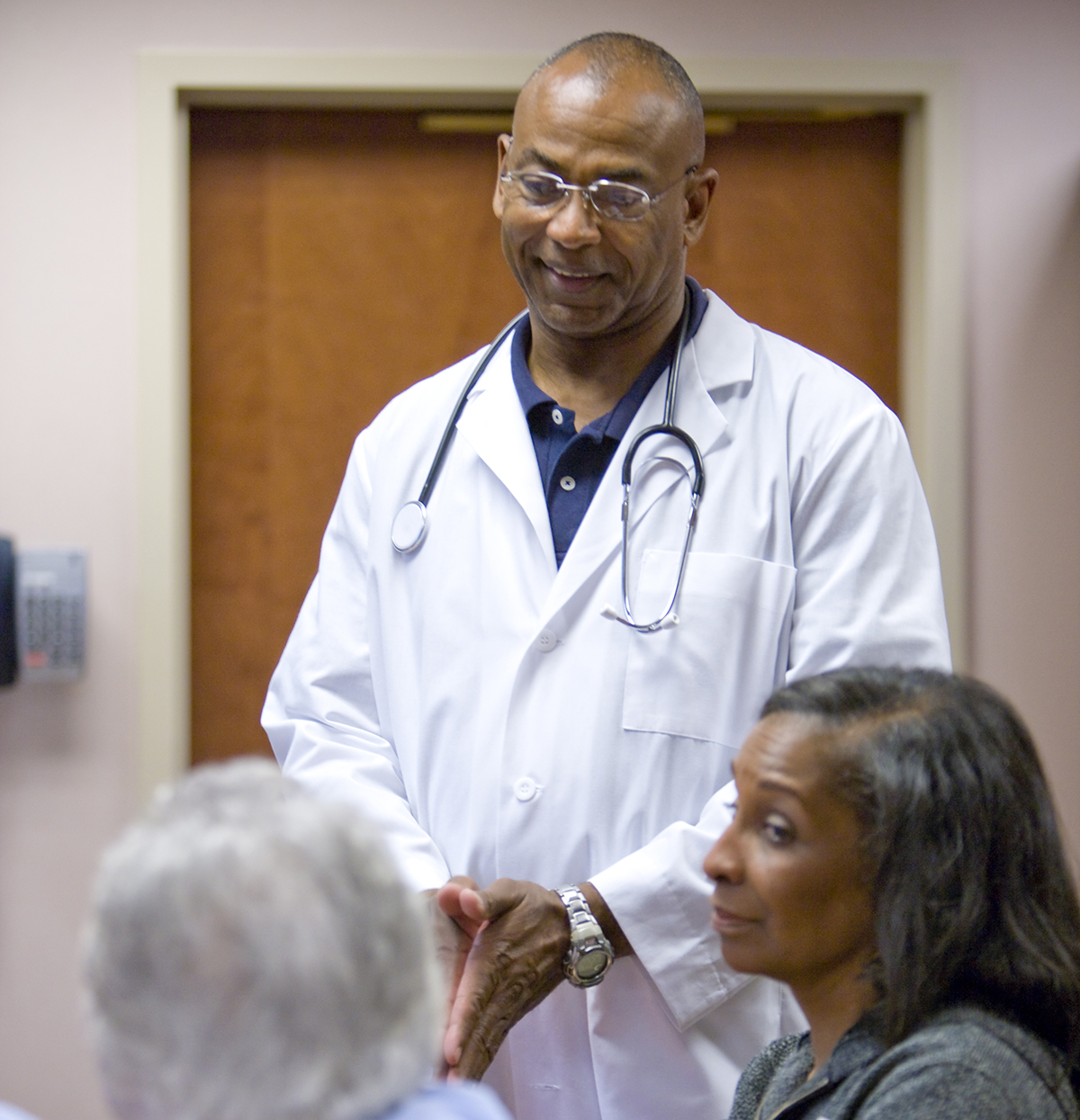 Doctor speaking with patients