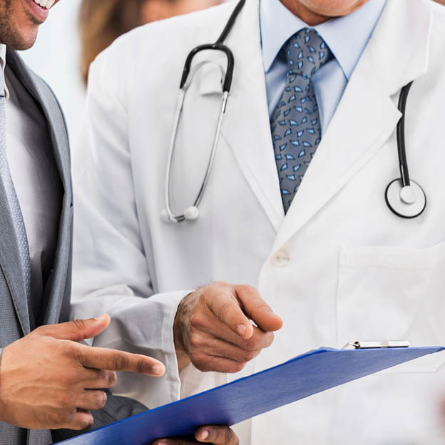 Mature doctor and African American businessman looking at documents  There are people around them    url http:  www istockphoto com search lightbox 9786662  img http:  dl dropbox com u 40117171 medicine jpg  img   url    url http:  www istockphoto com search lightbox 9786622  img http:  dl dropbox com u 40117171 business jpg  img   url