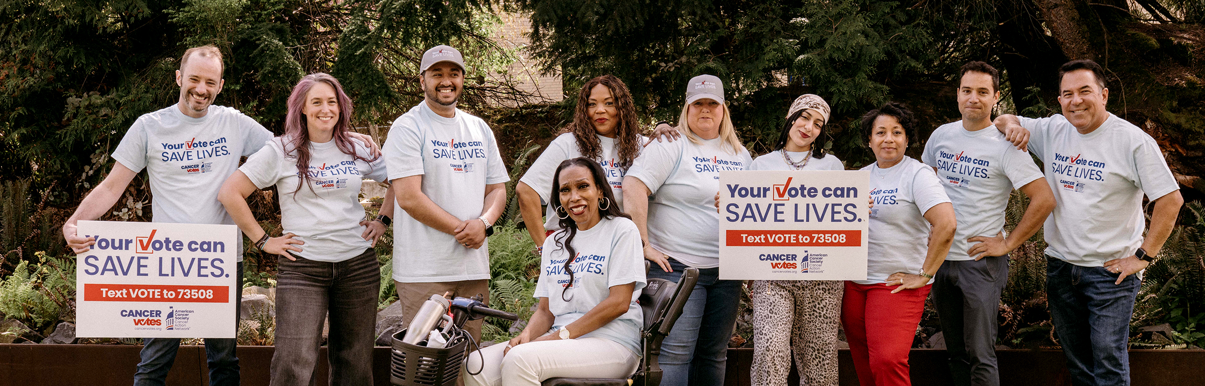 CancerVotes Volunteers holding signs