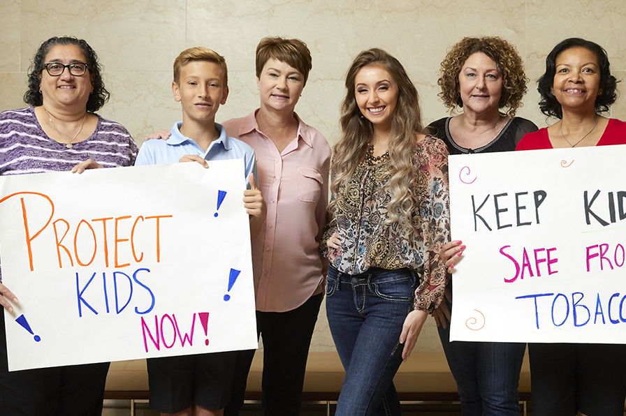 Volunteers holding signs