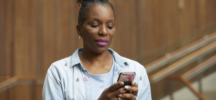 Woman typing on her phone