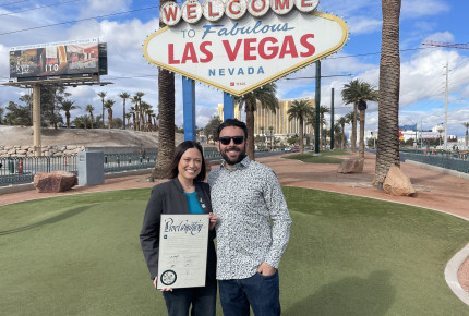 Pictured with her husband during Cervical Cancer Awareness Month event at Las Vegas Sign