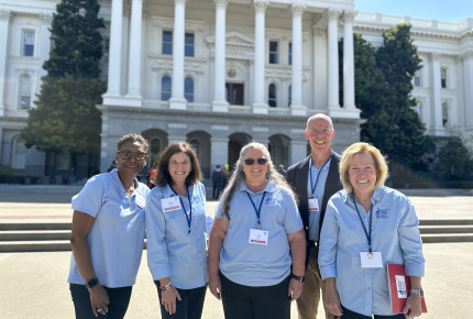 ACS CAN volunteers stand in front of the California Capitol