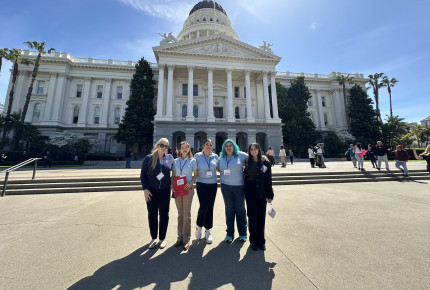 ACS CAN volunteers stand in front of the California Capitol