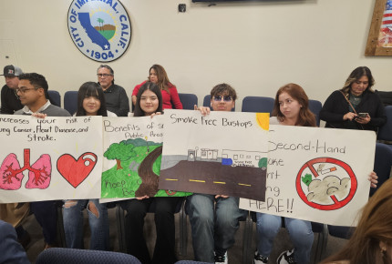 Imperial High School students hold posters advocating for a smoke-free ordinance before the City Council