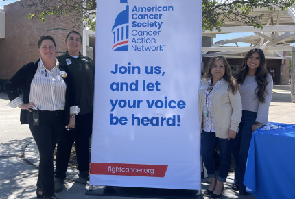 Cristal Martínez and Lupe Delgado stand next to an ACS CAN sign joined by Pitman High School Assistant Principal Wendi Cook and Dean of Students Marya Moreno