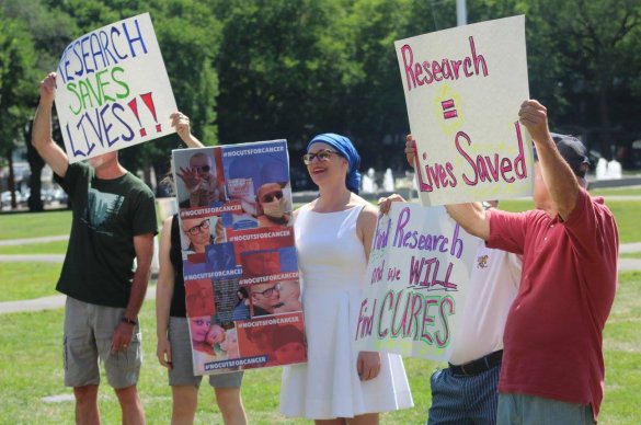 Advocates holding signs