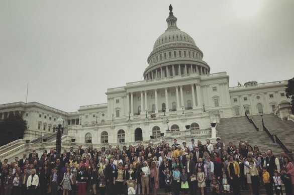 Members of the Alliance for Childhood Cancer pose for a photo on the group's annual lobby day. 