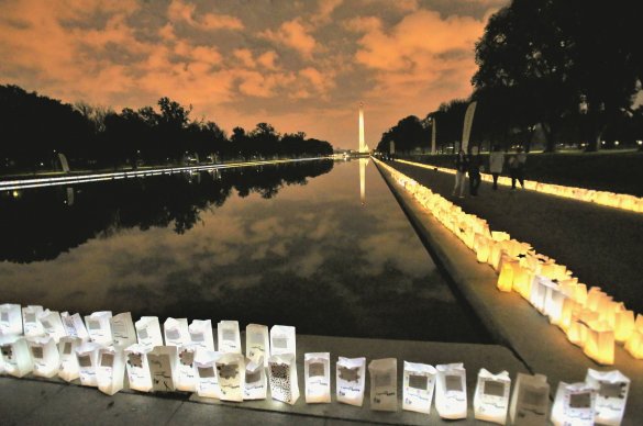 Lights of Hope bags line the Reflecting Pool. 