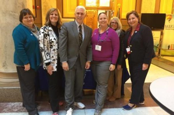 Volunteers with Indiana governor