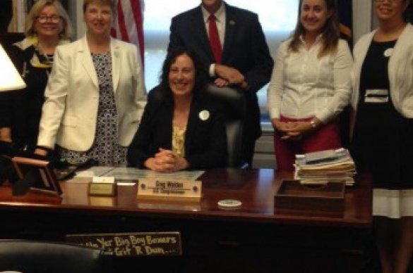 Volunteers surrounding desk