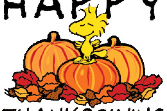Peanuts character sitting on pumpkins