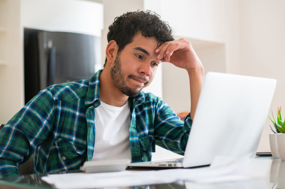 Man looking frustrated with his home finances
