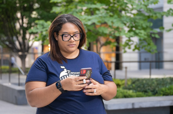Volunteer using their phone