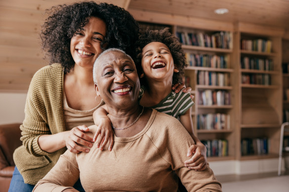 Photo of family hugging and smiling
