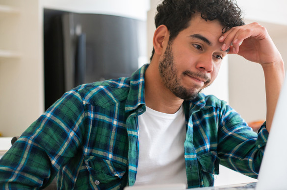 Man looking frustrated with his home finances