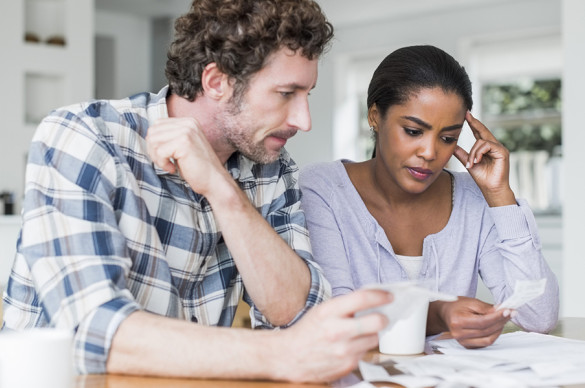 Couple reading medical bills