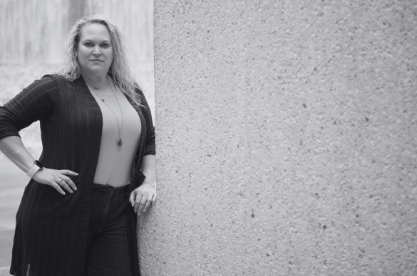 woman with serious expression posing and staring at camera, black and white image