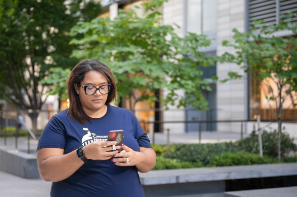LSLD Volunteer looking down at phone