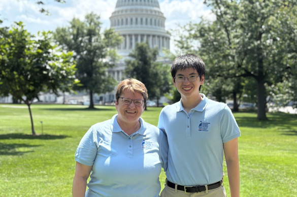 matthew high school volunteer with fellow acs can volunteer in front of US Capitol