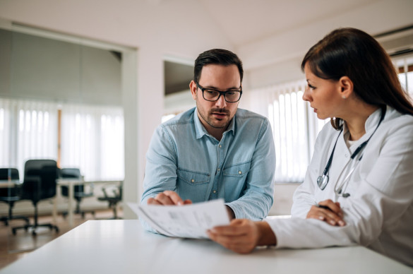 Man and Doctor look at papers