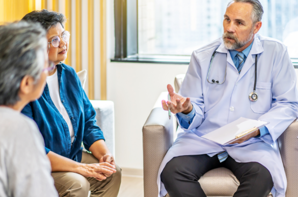Doctor with patient and caregiver.