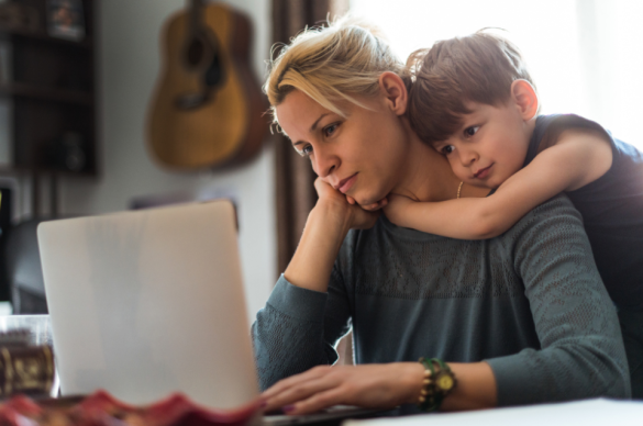 Mom with son working on laptop