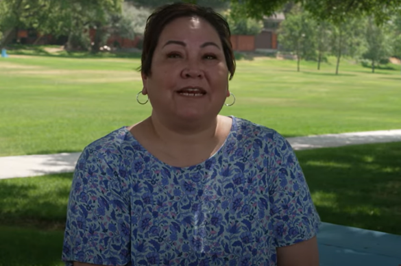 Video still of woman in park being interviewed