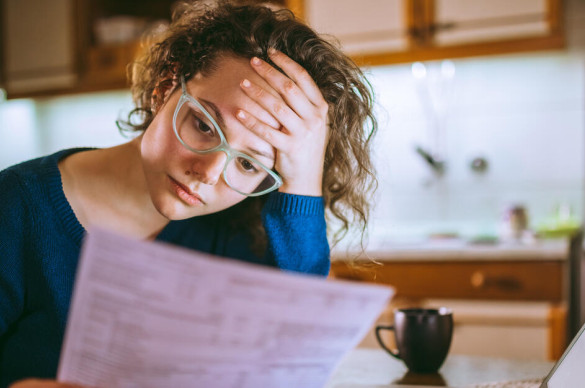 Woman looking at bill