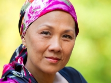 Photo of female Cancer patient with a pink scarf