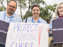Volunteers holding signs at a rally