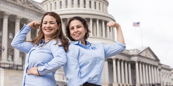 Volunteers standing in front of the U.S. Capitol