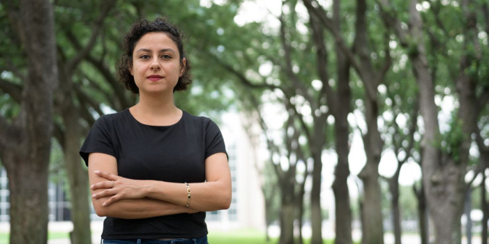 Woman standing with arms crossed Woman standing with arms crossed