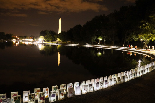 washington monument in background lights of hope surrounding pond