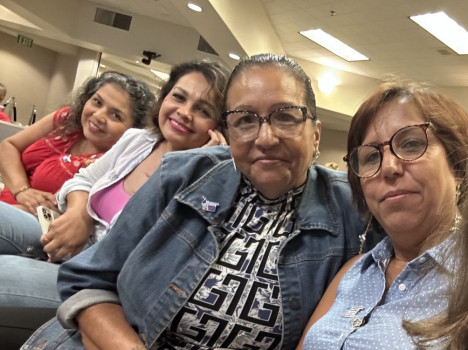 ACS CAN volunteers sit and smile together