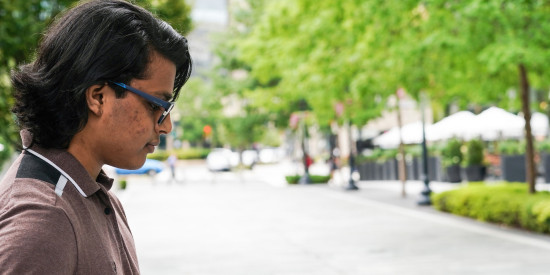 Man looking down at his phone