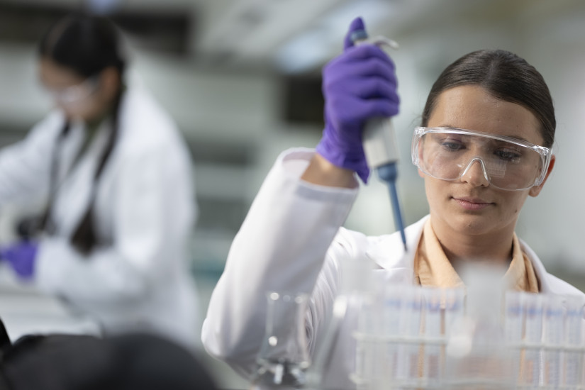 researcher working with test tubes