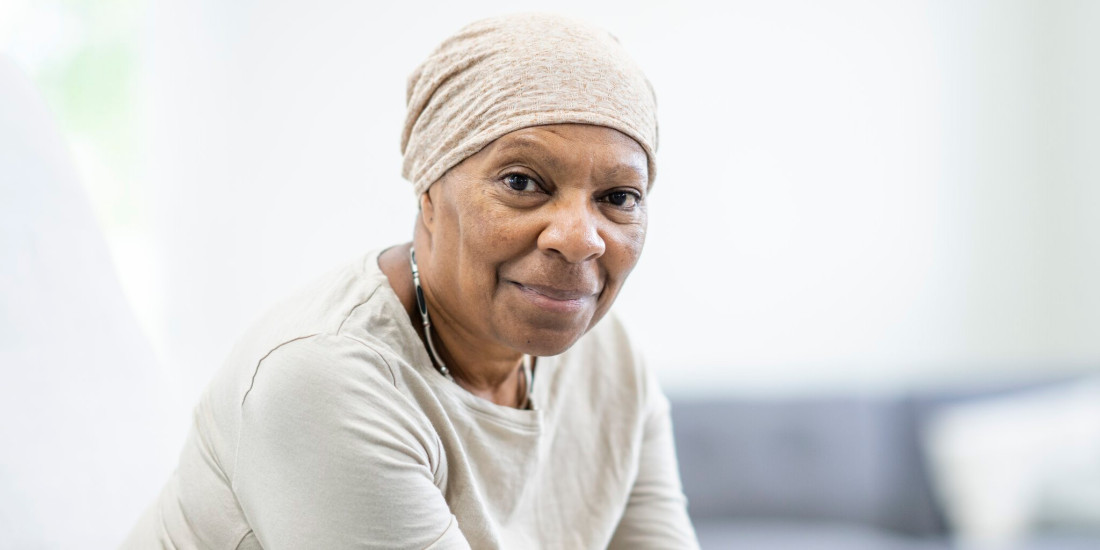 african american woman looking directly at camera with soft smile