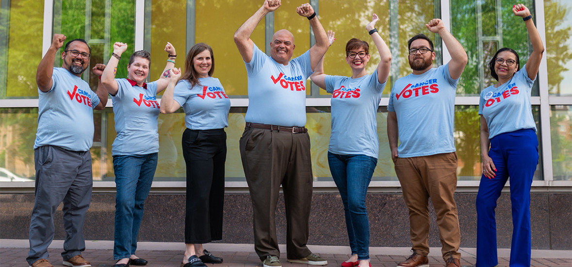 Cancer Votes volunteers raising their arms