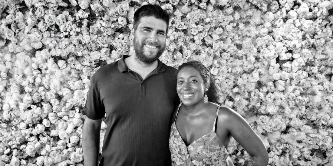josh and partner smiling at camera_black and white