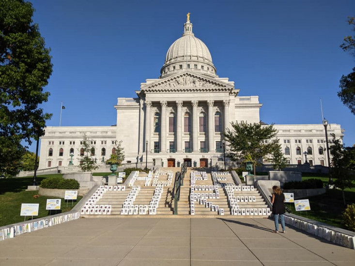 Lights of Hope bags spell the words 'hope' and 'cure' on Wisconsin State Capitol's steps.