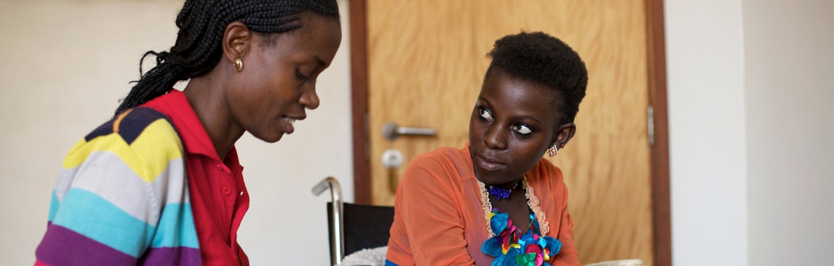 Photo of female caregiver and patient in treatment