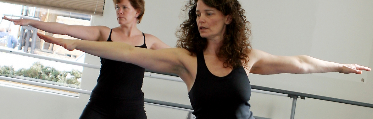 Photo of two women doing yoga and being active