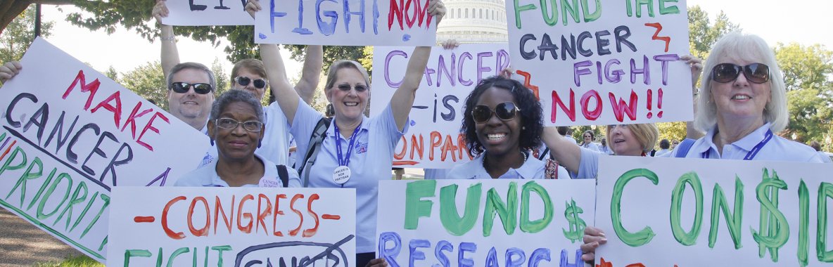 Volunteers holding signs at advocacy rally