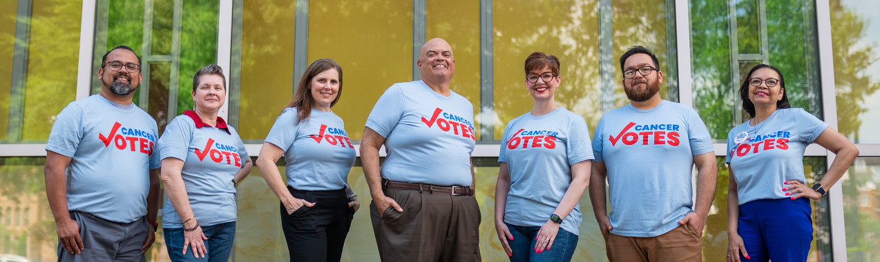 A group of volunteers wearing Cancer Votes t-shirts