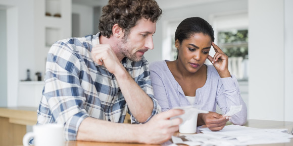 Couple reading medical bills
